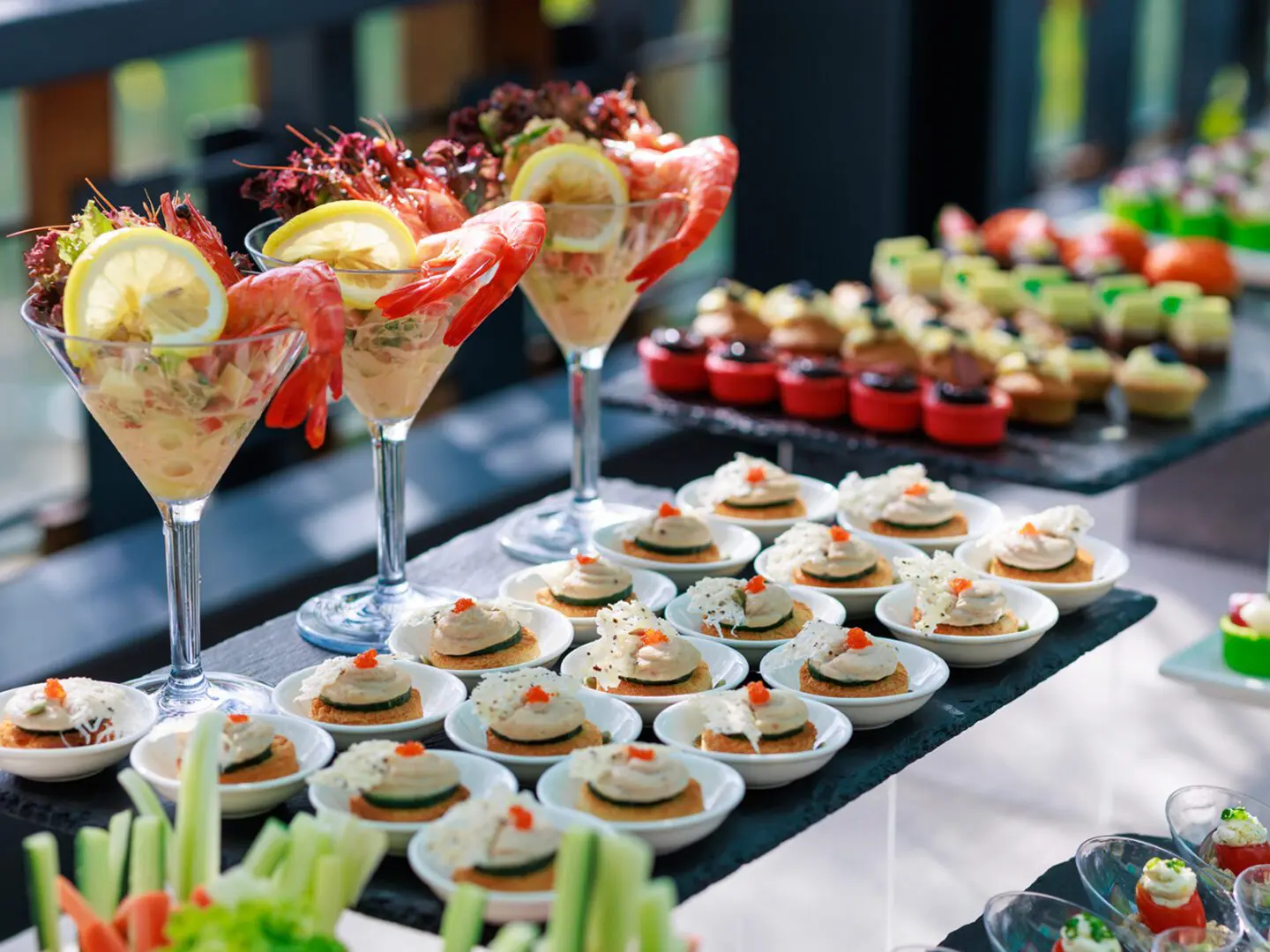 Assorted appetizers on display at a buffet.