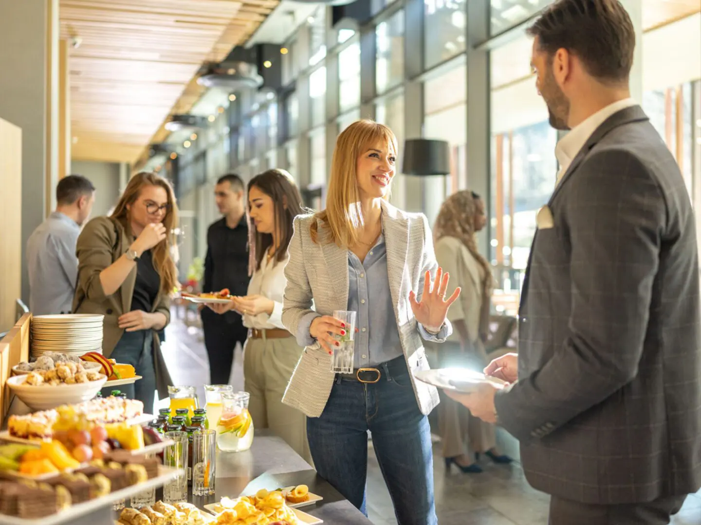 People socializing at a buffet event.