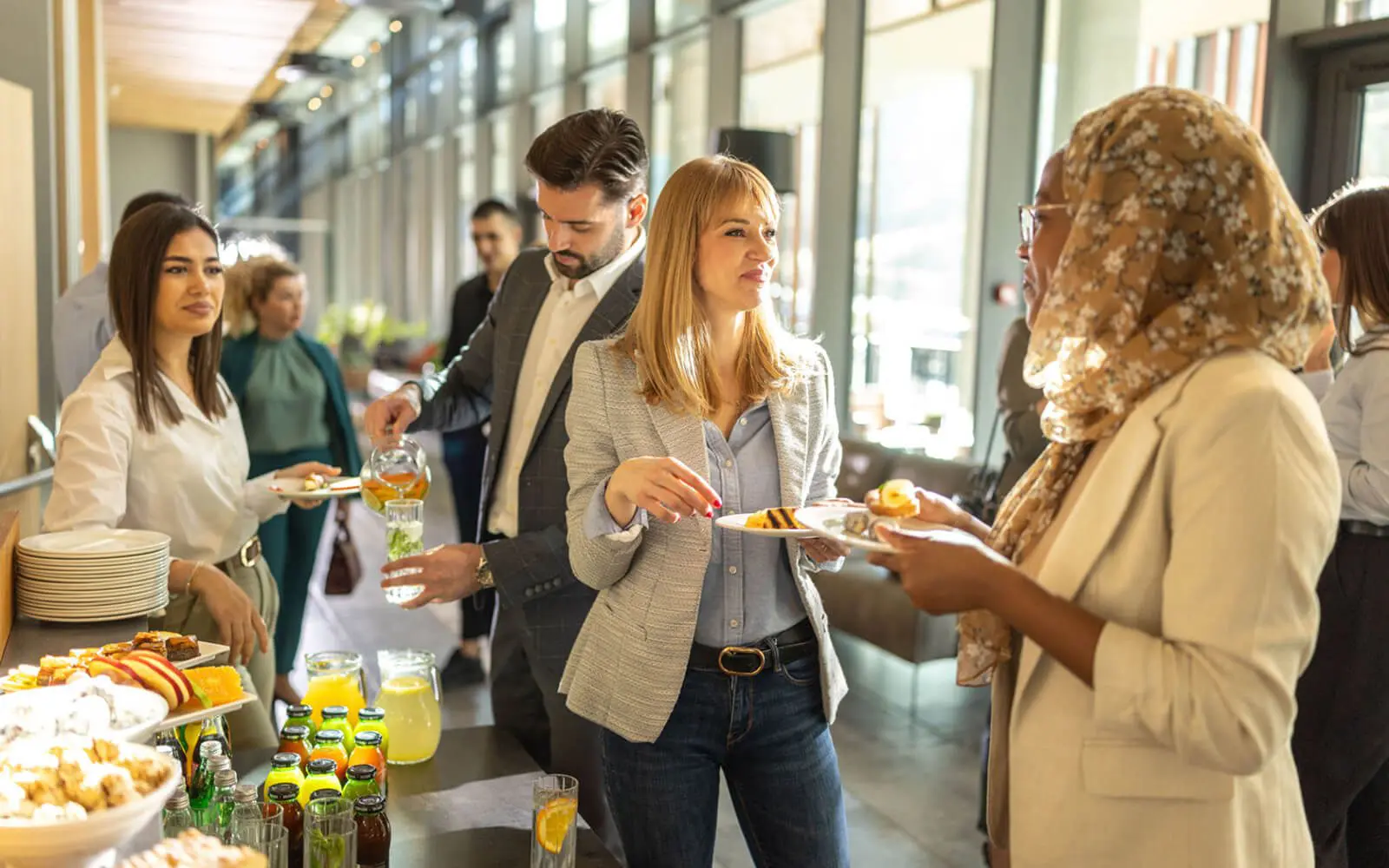 People socializing at a buffet event.