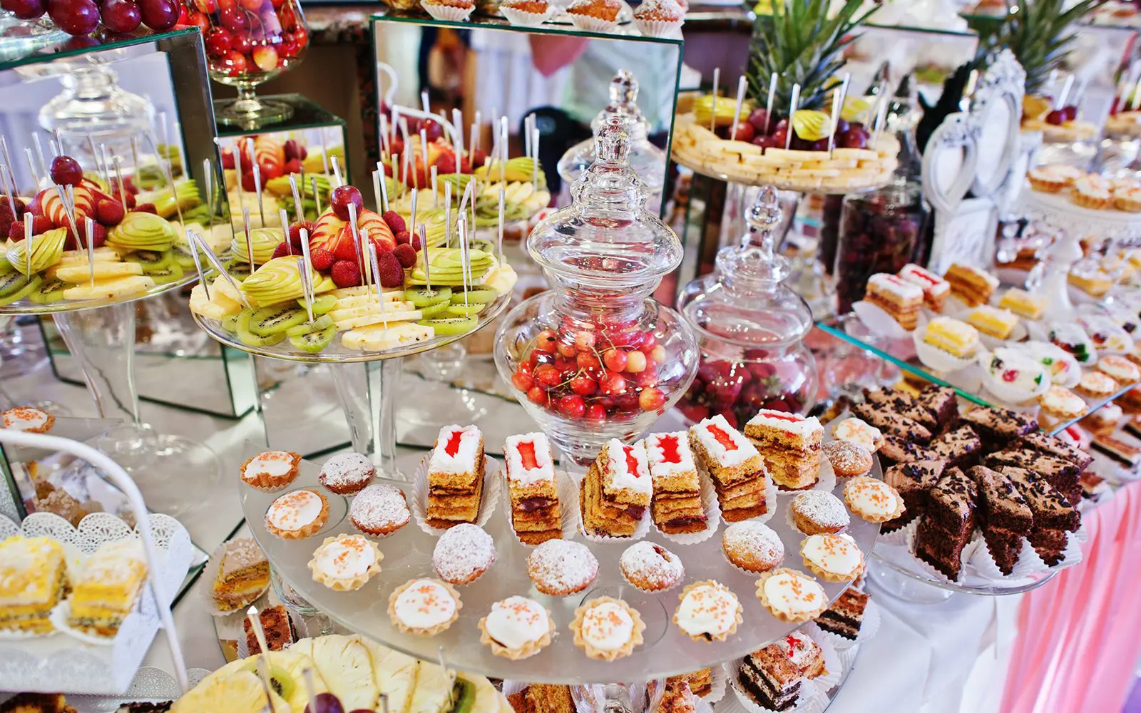 Dessert buffet with assorted cakes and pastries.